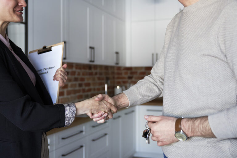 Your Key Move estate agents in Folkestone. Handshake following a house valuation.